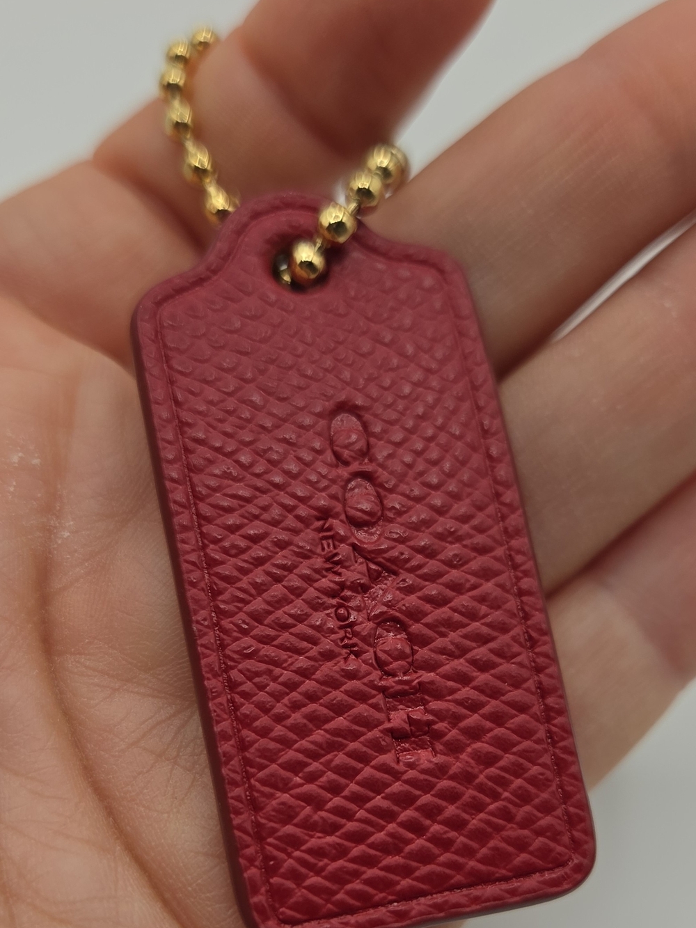 Coach Pink-Red Textured Leather Key Tag with Gold Ball Chain